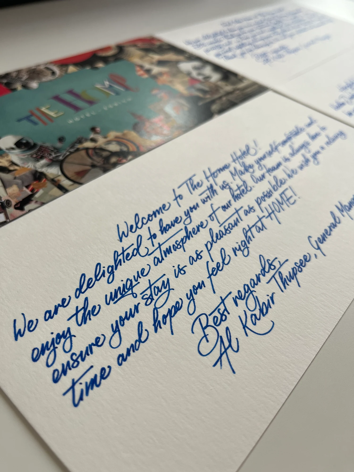 Blue handwritten welcome card for The Home Hotel Zurich
