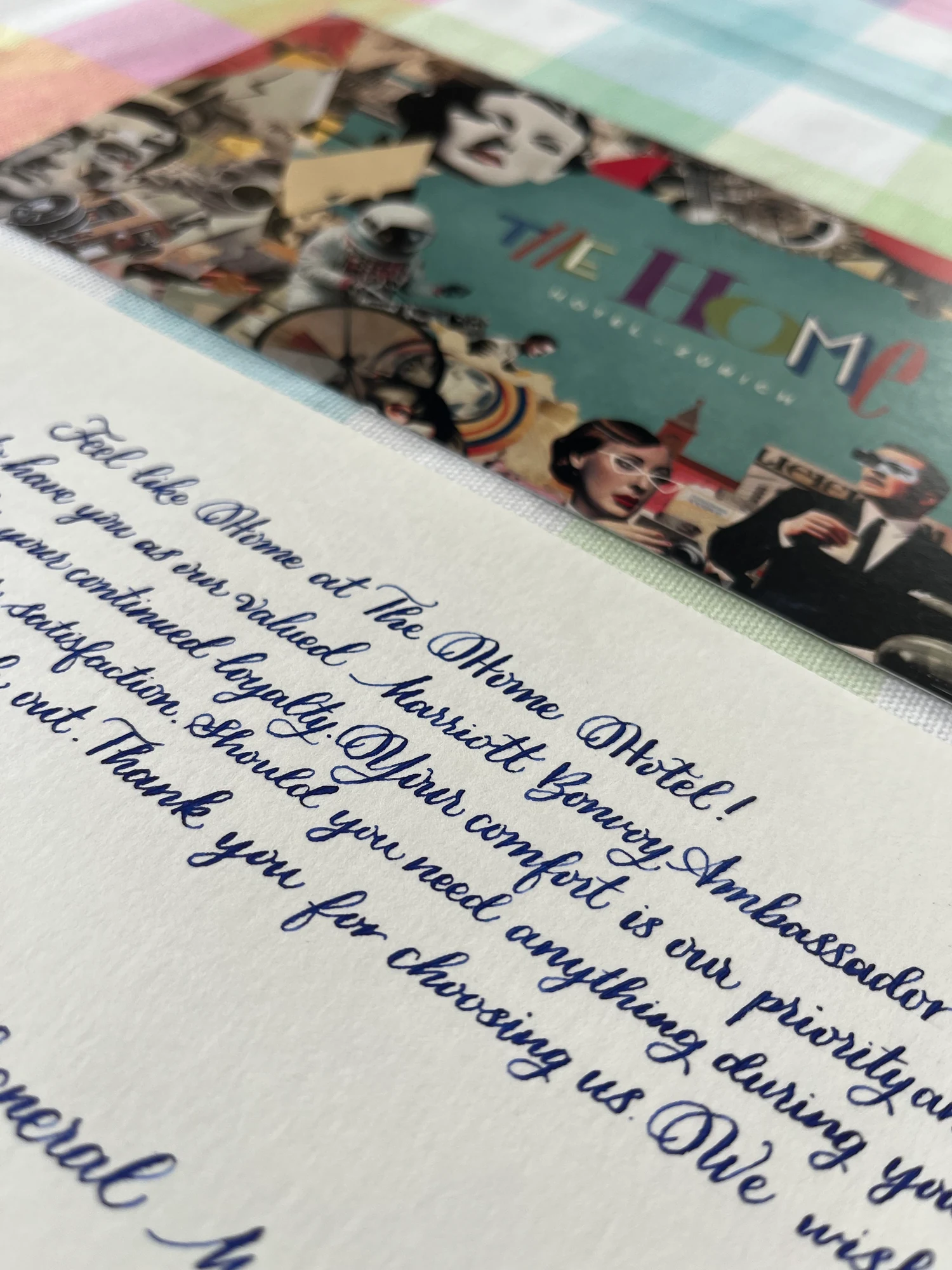 Close-up of the initial English welcome card in traditional calligraphy