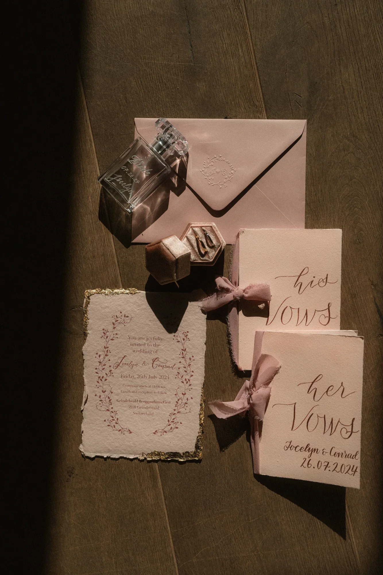Blush wedding stationery, hand-lettered envelopes and engraved perfume bottle