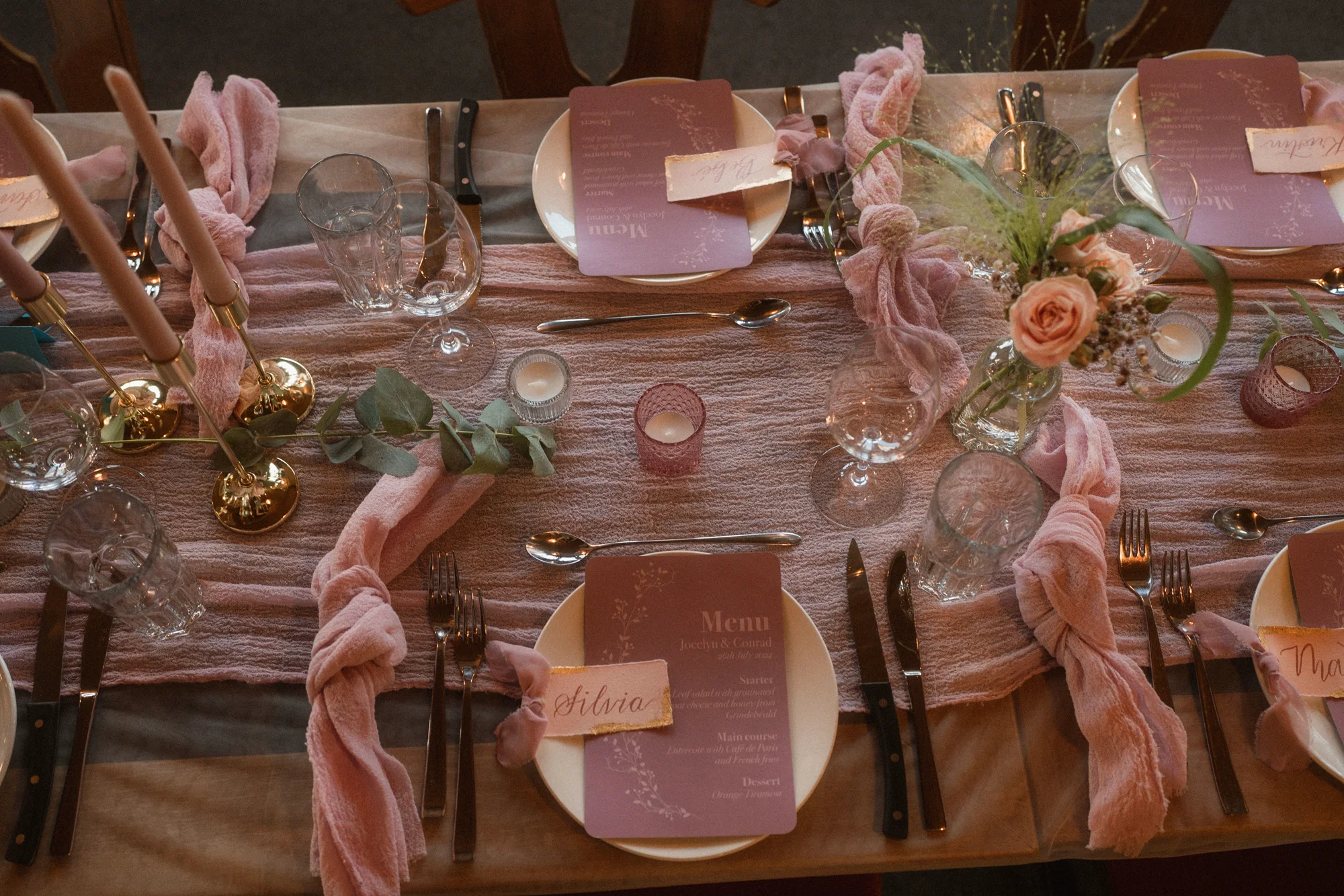 Blush wedding table with hand-lettered menus and place cards