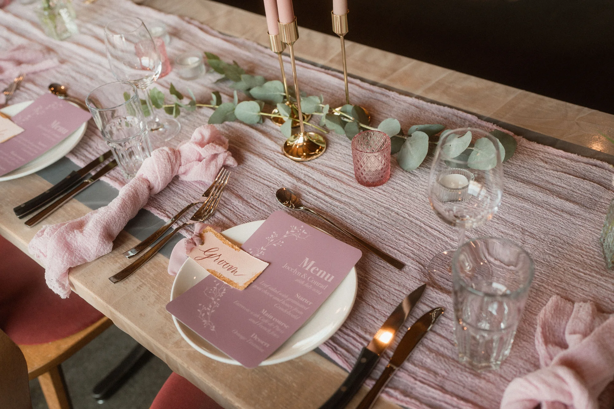 Blush wedding table with hand-lettered place card and coordinated menus